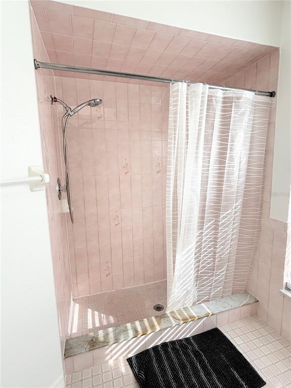 1503 Overland Drive Spring Hill, FL 34608 - Photo 14 of 20 a bathroom with a bathtub and shower