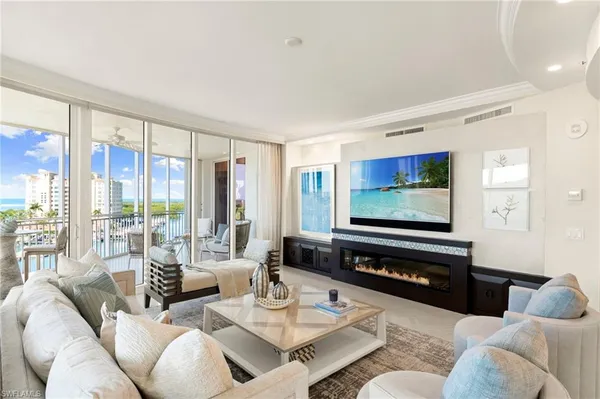 a kitchen with a sink a refrigerator and a stove top oven
