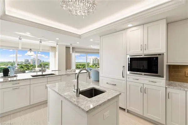a large bathroom with a large tub and sink