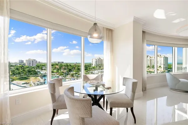 a kitchen with a sink dishwasher and a stove with wooden floor