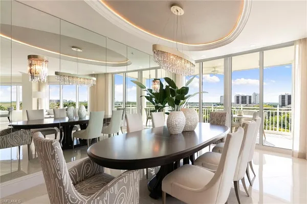 a bedroom with a large bed and a large window