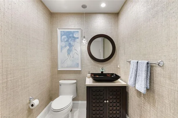 a view of a swimming pool with a garden and trees