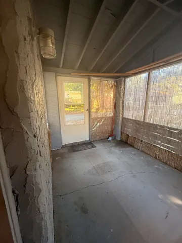 a view of room with window and hardwood floor
