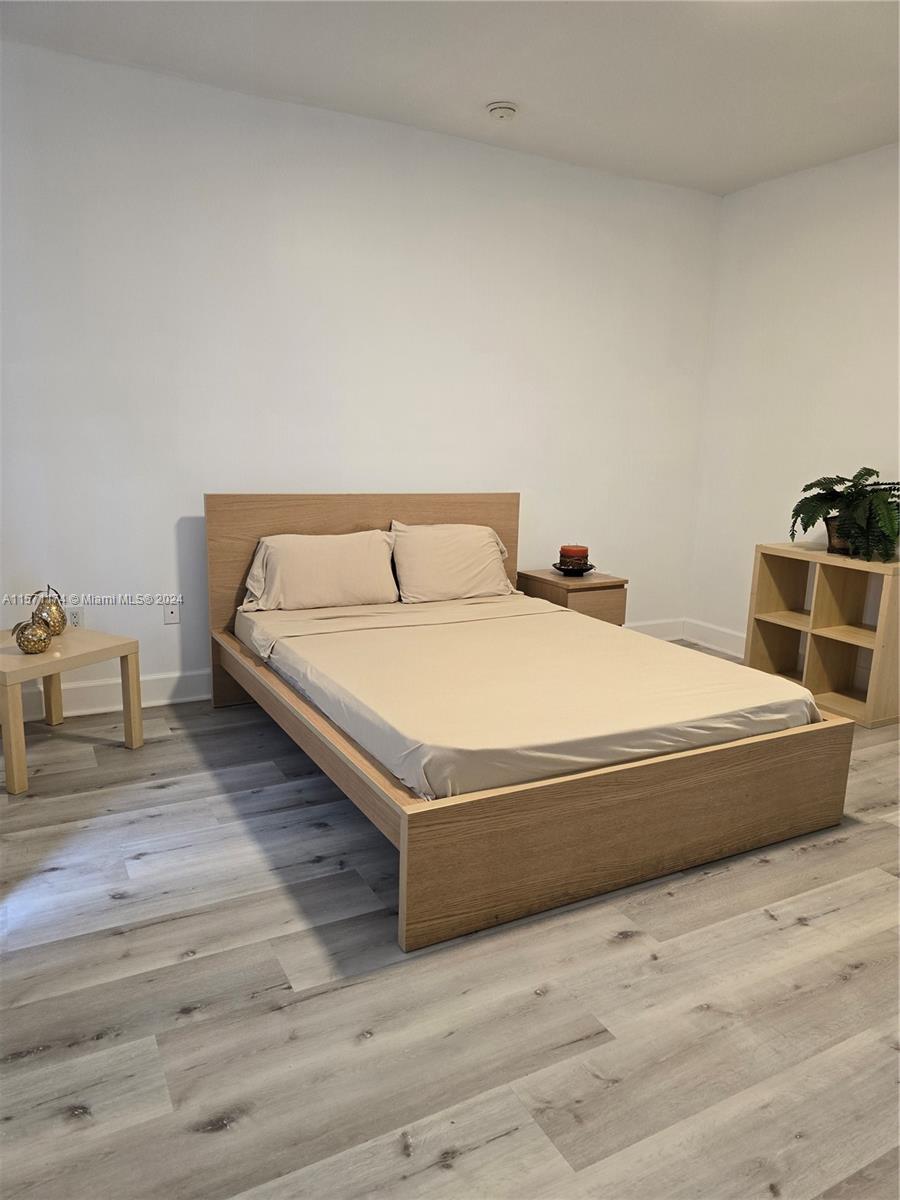 a bedroom with a bed and a table