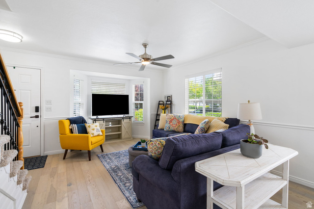 732 North 200 E Street Springville, UT 84663 - Photo 9 of 36 Bright living area featuring wood-finish flooring, a ceiling fan, and white baseboards