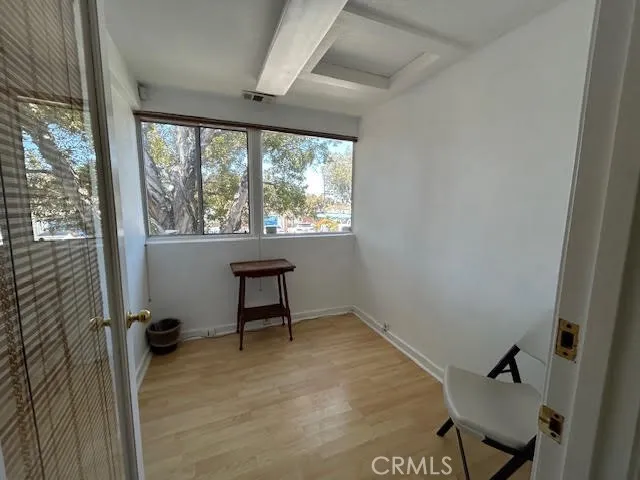 a room with furniture a flat screen tv and a window