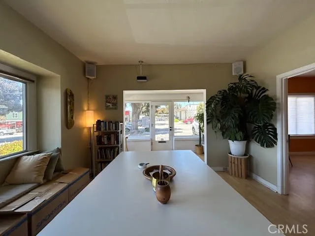 a hallway with a couch and a potted plant