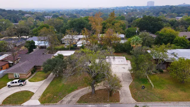 an aerial view of a house with outdoor space