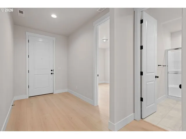 a large kitchen with kitchen island a sink stainless steel appliances and cabinets