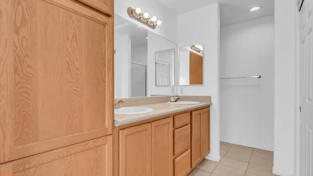 a view of empty room with wooden floor and ceiling fan