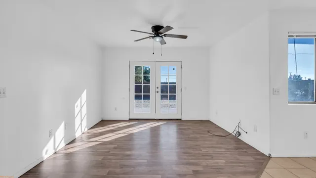 a spacious bathroom with a granite countertop sink and a mirror