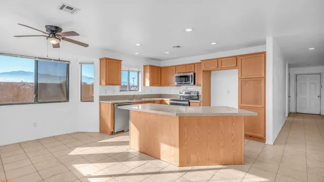 a view of a hallway to rooms