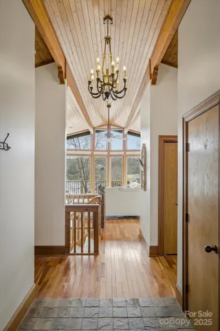 a view of a porch with wooden floor and outdoor space