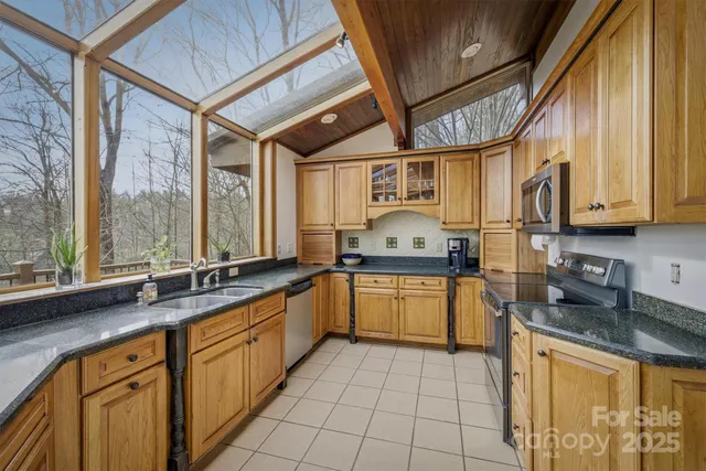 a dining room with furniture and a chandelier