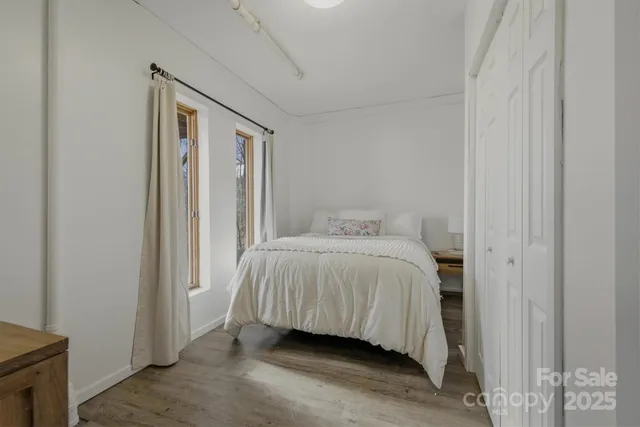 a bedroom with a bed and a couch