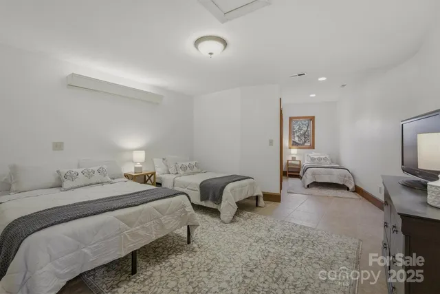 a bedroom with a large bed and a large window