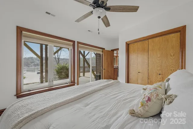 a spacious bedroom with a bed and a window