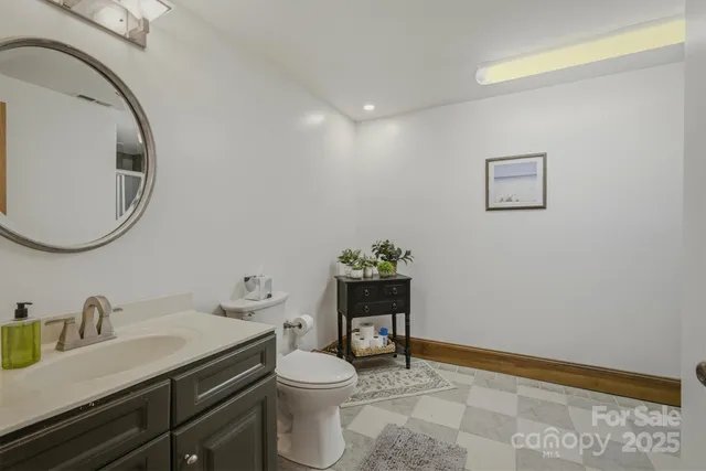 a bathroom with a glass shower door