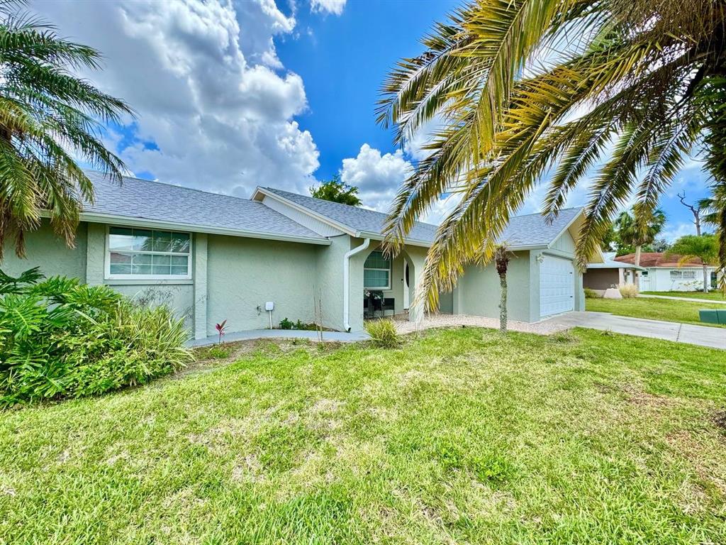 4282 Rudder Way New Port Richey, FL 34652 - Photo 3 of 34 a house view with a garden space