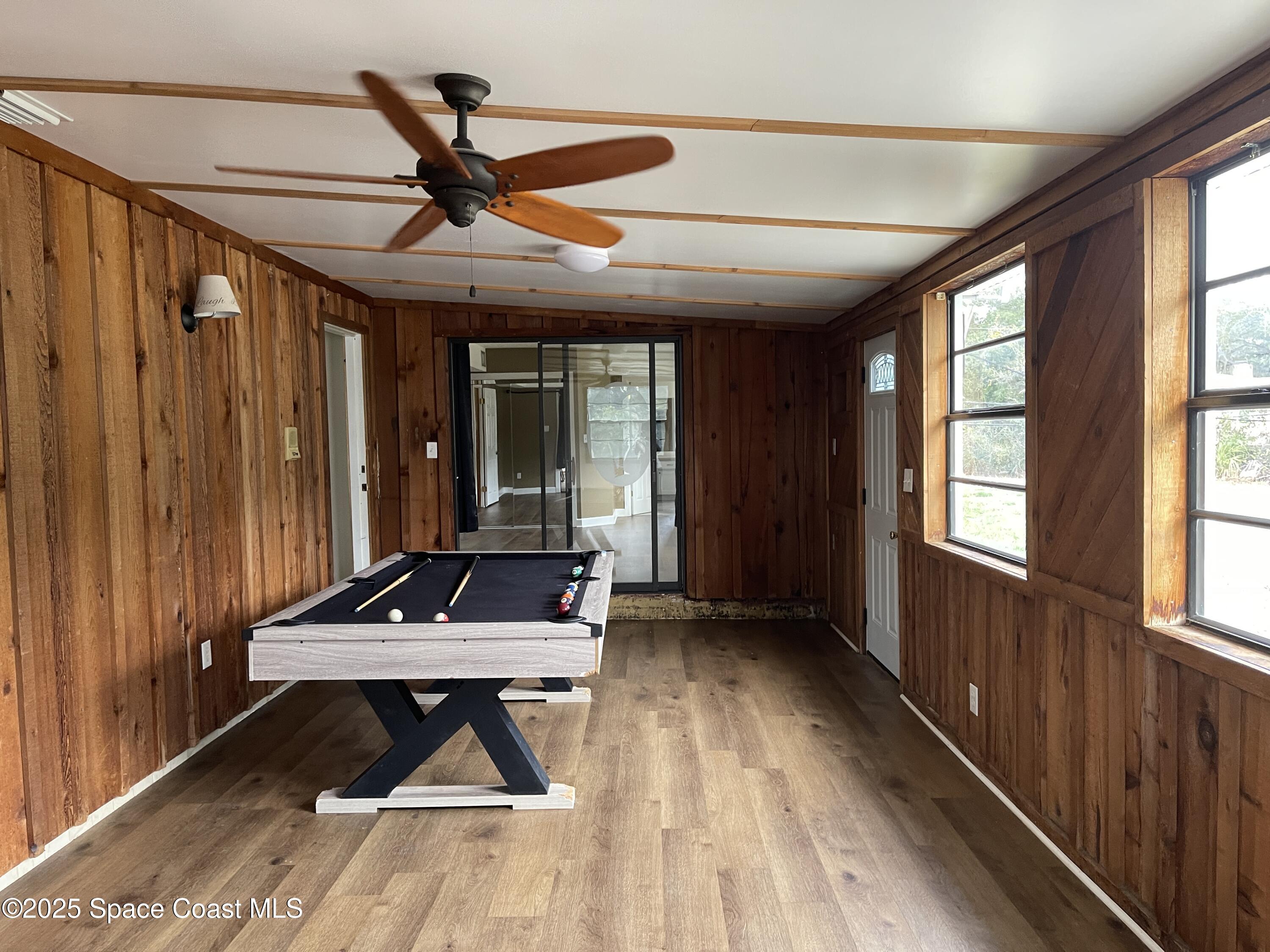 3445 Fox Lake Road Titusville, FL 32780 - Photo 13 of 43 a very nice looking room with wooden floor and furniture