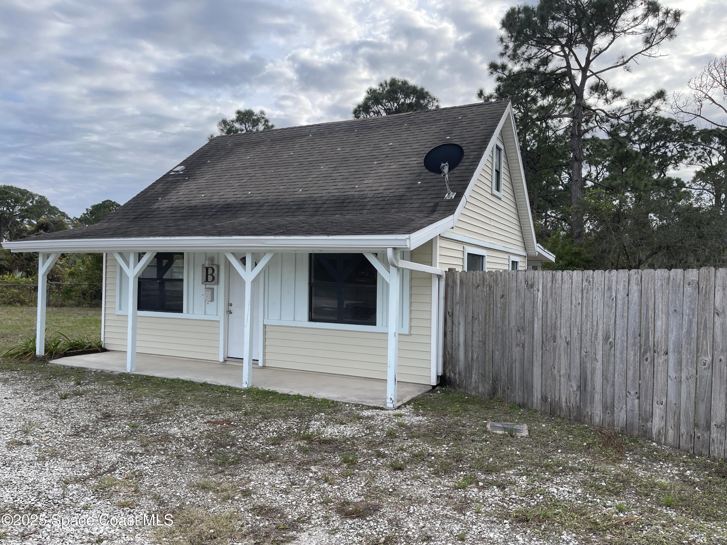 3445 Fox Lake Road Titusville, FL 32780 - Photo 23 of 43 a view of a house with a yard