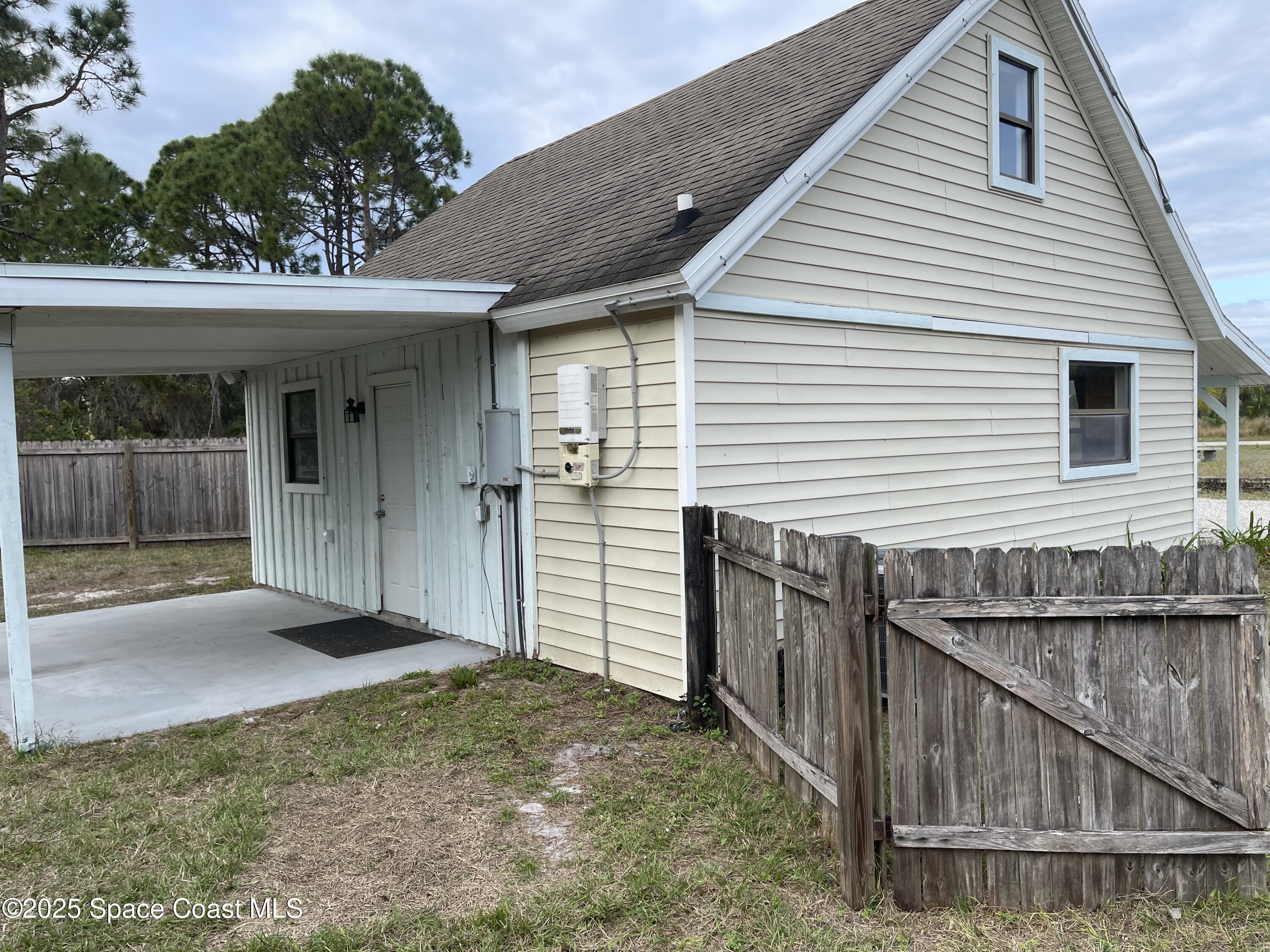 3445 Fox Lake Road Titusville, FL 32780 - Photo 25 of 43 a front view of a house with balcony