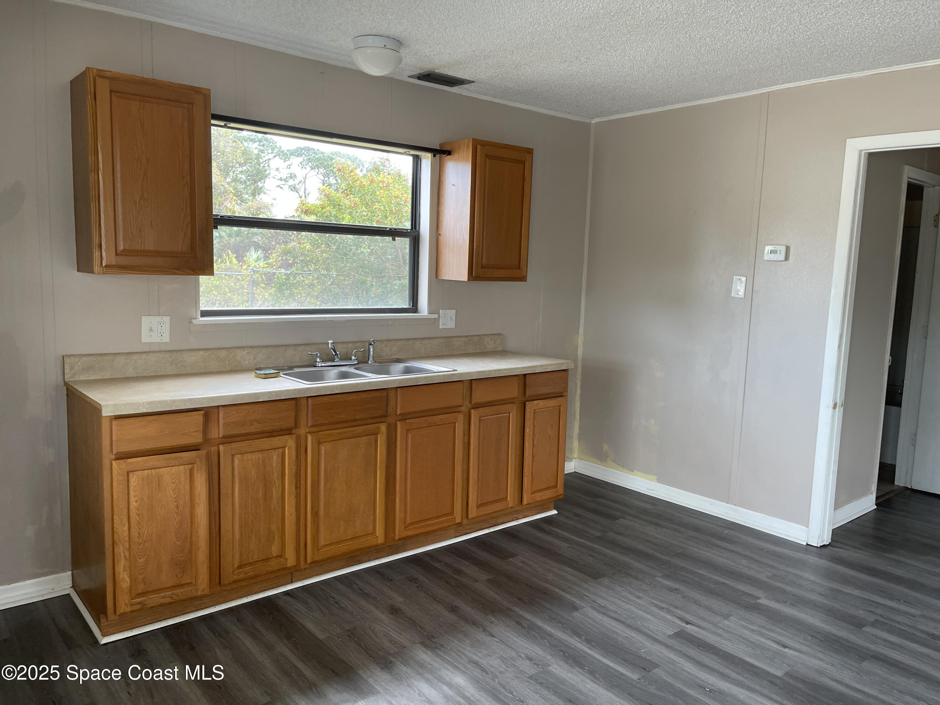 3445 Fox Lake Road Titusville, FL 32780 - Photo 26 of 43 a bathroom with a sink and a mirror