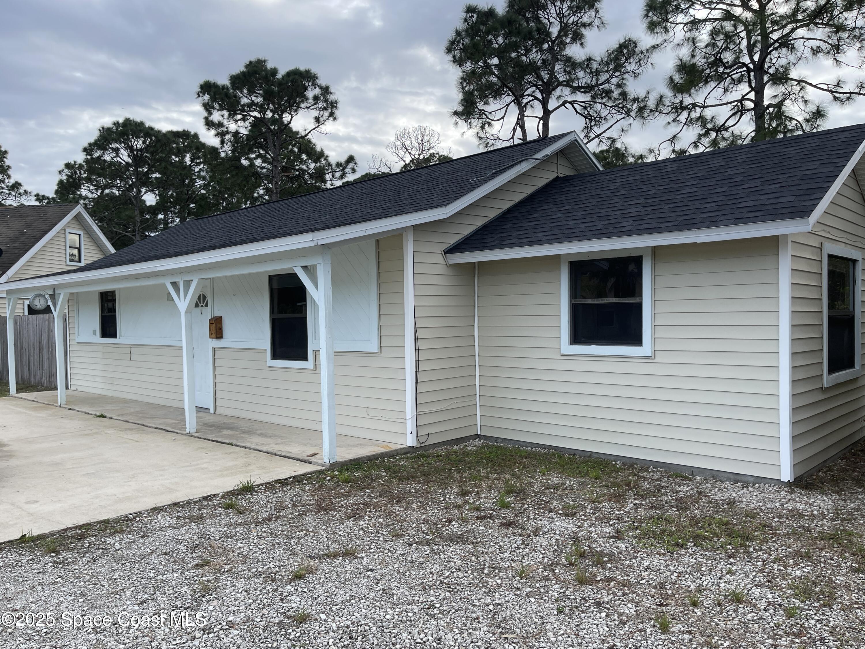 3445 Fox Lake Road Titusville, FL 32780 - Photo 32 of 43 a view of a house with a backyard