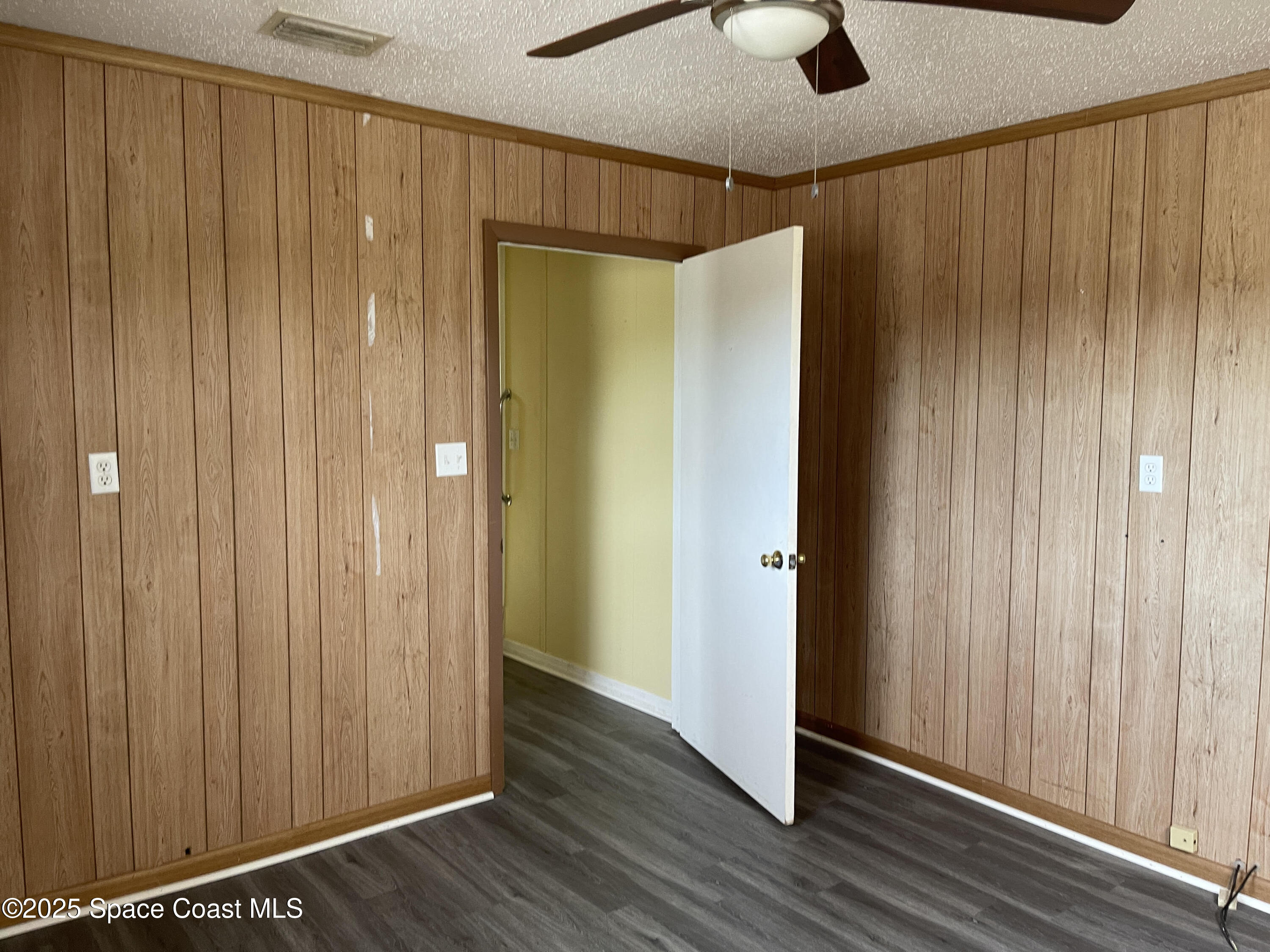 3445 Fox Lake Road Titusville, FL 32780 - Photo 40 of 43 a view of a hallway with wooden floor