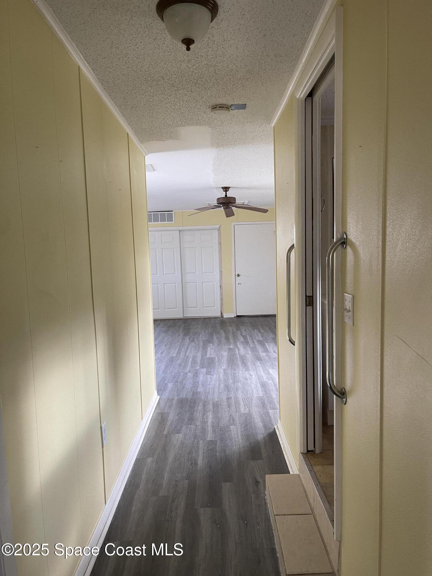 3445 Fox Lake Road Titusville, FL 32780 - Photo 41 of 43 a view of hallway with wooden floor