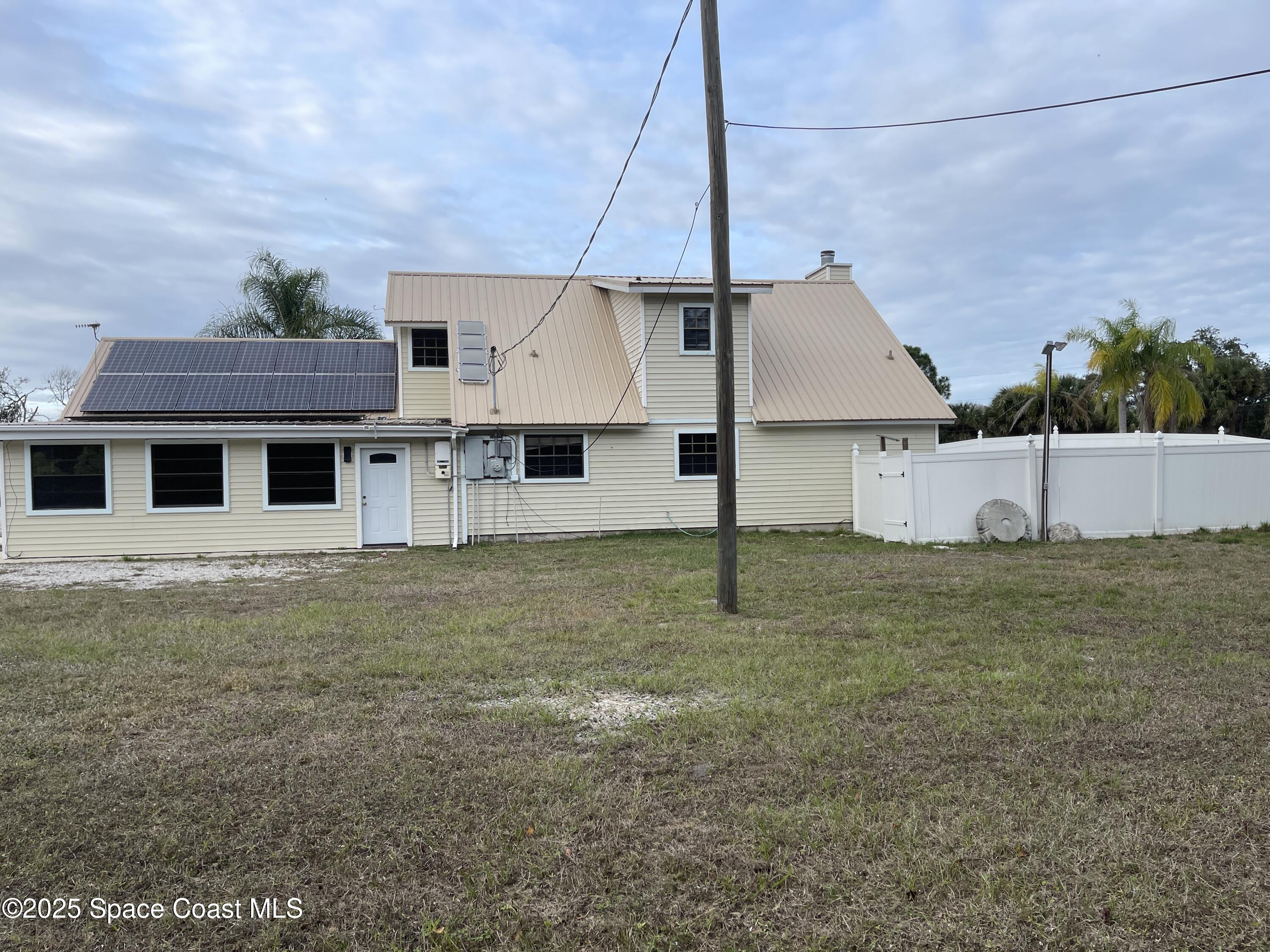 3445 Fox Lake Road Titusville, FL 32780 - Photo 7 of 43 a house view with a backyard space