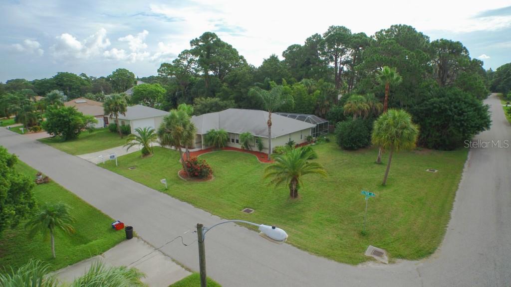 5981 Elton Road Venice, FL 34293 - Photo 1 of 1 Lovely 3 bed . home with Family Room, Pool, 2 car garage + detached 2 1/2 car garage w. A/C work shop.