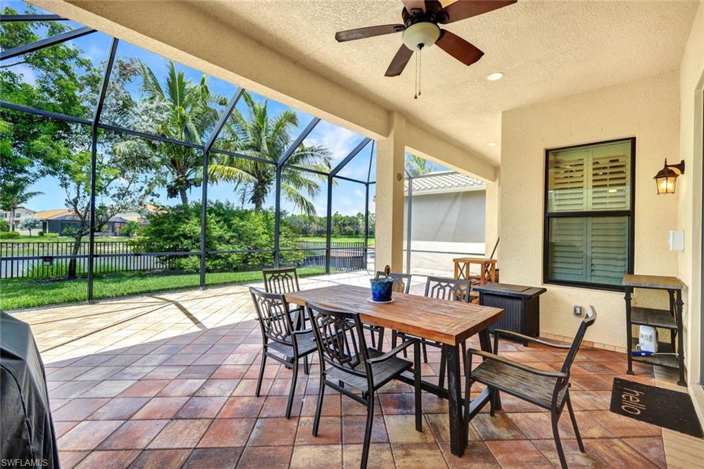 13673 Mandarin Circle Naples, FL 34109 - Photo 2 of 2 a view of an outdoor dining space with a table and chairs