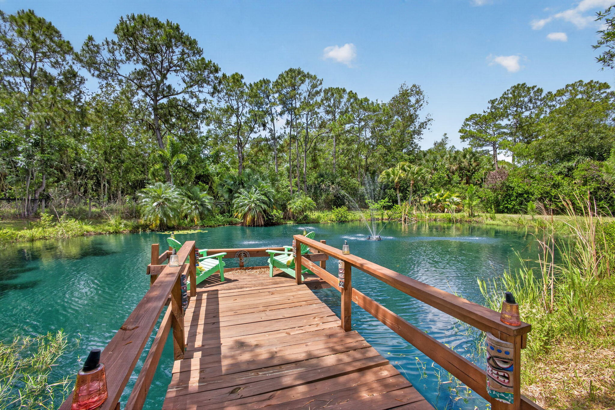 12558 165th Road North Jupiter, FL 33478 - Photo 3 of 67 a view of wooden deck with a lake view