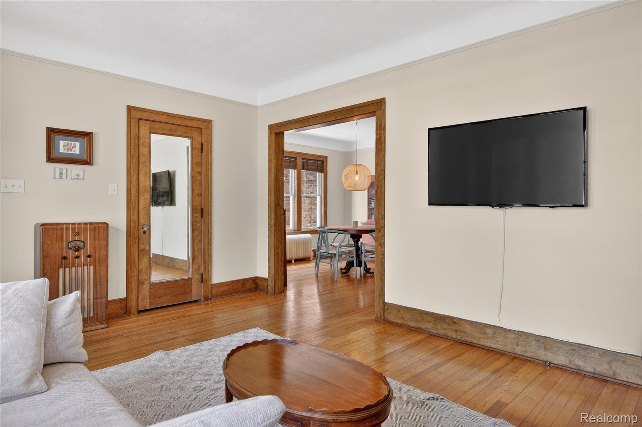925 Nottingham Road Grosse Pointe, MI 48230 - Photo 14 of 46 Living room with light wood-style flooring and radiator heating unit