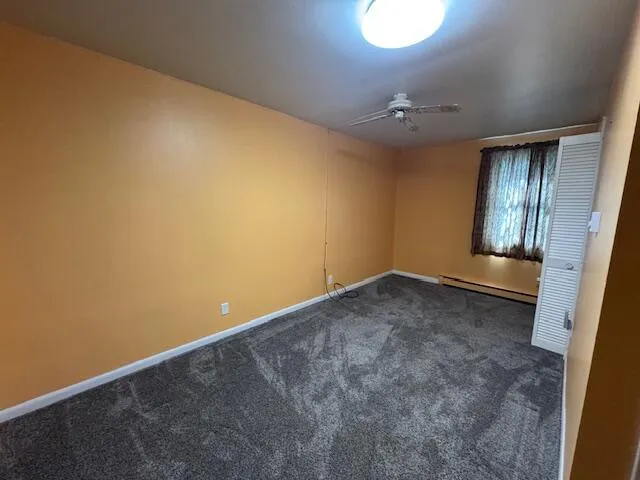 an empty room with a empty space and windows