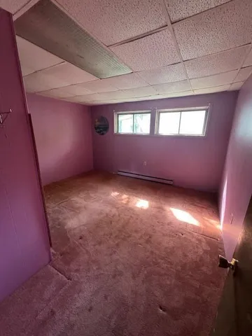 a kitchen that has a sink a stove and cabinets