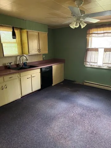 a kitchen with sink and window