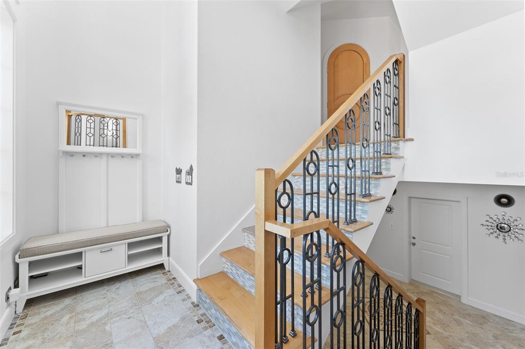 4150 Snail Island Court Boca Grande, FL 33921 - Photo 11 of 98 a view of entryway with wooden floor and stairs