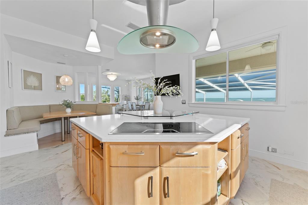 4150 Snail Island Court Boca Grande, FL 33921 - Photo 15 of 98 a kitchen with a sink a counter space and a view of living room