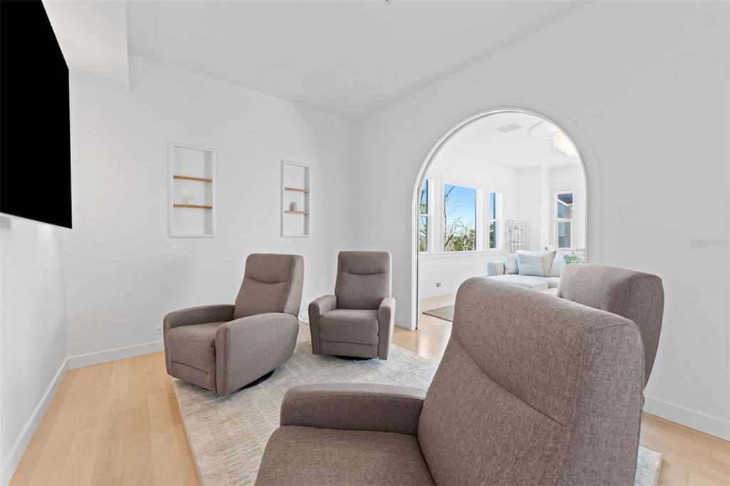 4150 Snail Island Court Boca Grande, FL 33921 - Photo 24 of 98 a living room with furniture and a flat screen tv