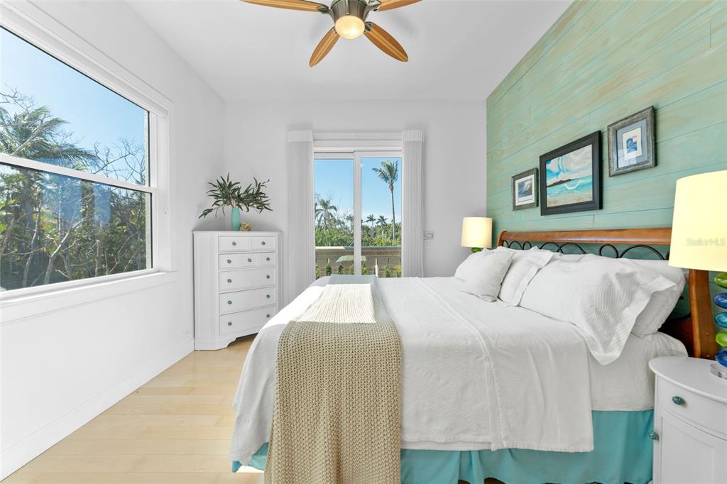 4150 Snail Island Court Boca Grande, FL 33921 - Photo 28 of 98 a bedroom with a bed and a window