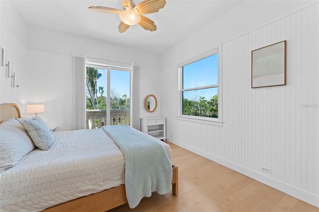 4150 Snail Island Court Boca Grande, FL 33921 - Photo 31 of 98 a bed sitting in a bedroom next to a window