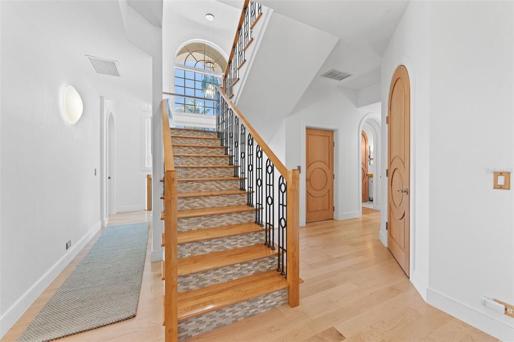 4150 Snail Island Court Boca Grande, FL 33921 - Photo 38 of 98 a view of entryway and hall with wooden floor