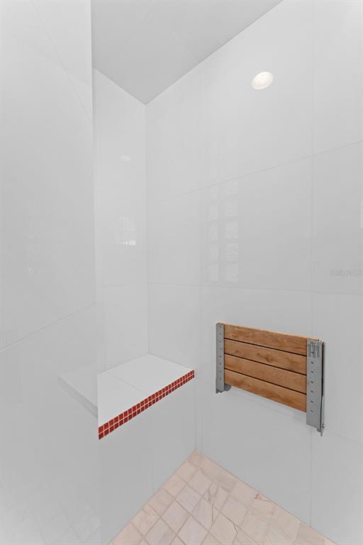 4150 Snail Island Court Boca Grande, FL 33921 - Photo 48 of 98 a view of room with stairs and a rug