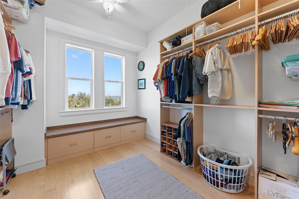 4150 Snail Island Court Boca Grande, FL 33921 - Photo 49 of 98 a view of walk in closet with clothes and shoes