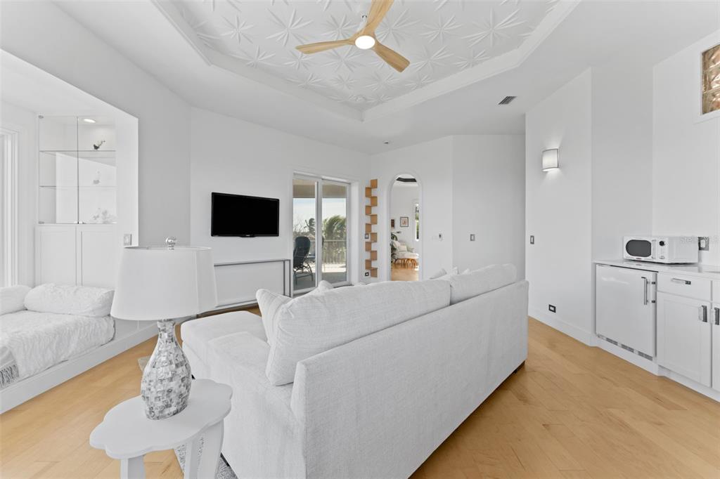 4150 Snail Island Court Boca Grande, FL 33921 - Photo 54 of 98 a living room with furniture and a flat screen tv