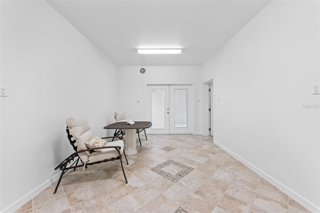 4150 Snail Island Court Boca Grande, FL 33921 - Photo 64 of 98 a view of a room with table and chair