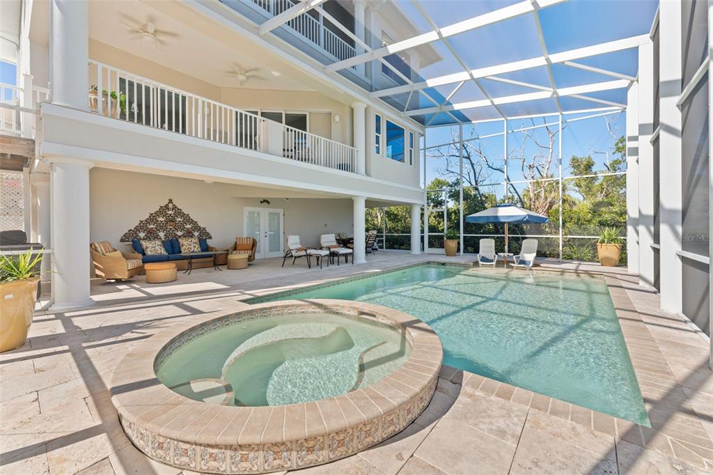 4150 Snail Island Court Boca Grande, FL 33921 - Photo 70 of 98 a house view with a swimming pool