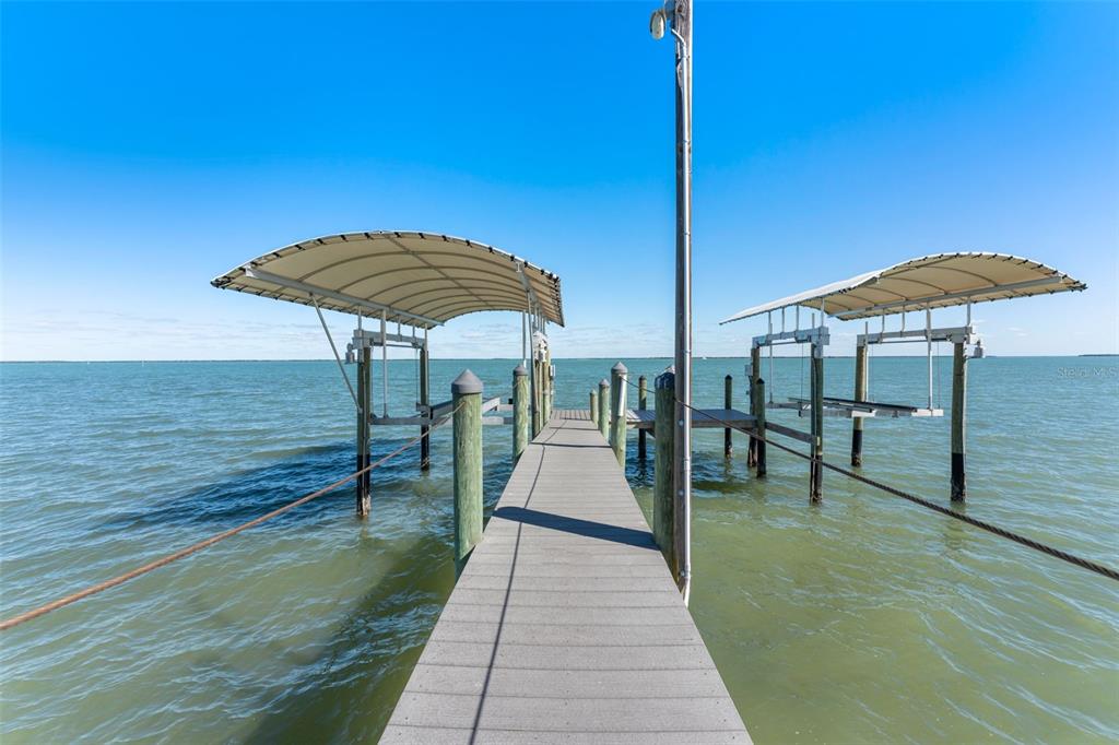 4150 Snail Island Court Boca Grande, FL 33921 - Photo 78 of 98 a view of a swimming pool with a patio